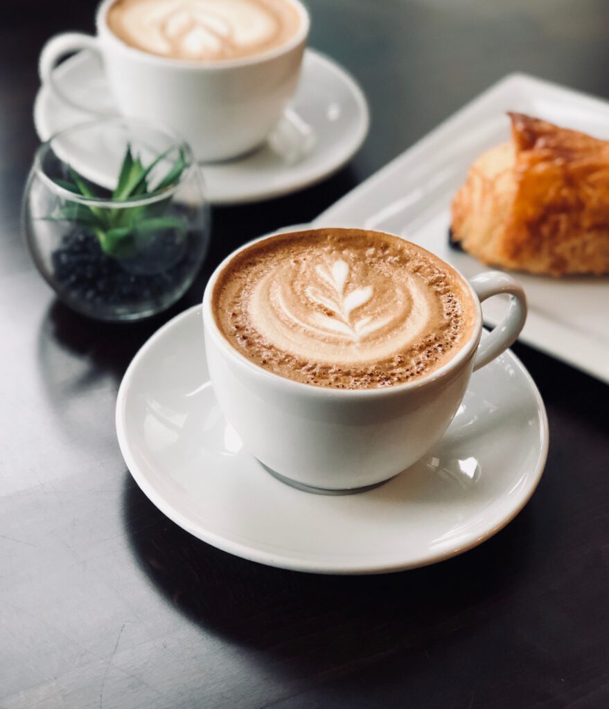A cup of coffee on a table
Description automatically generated